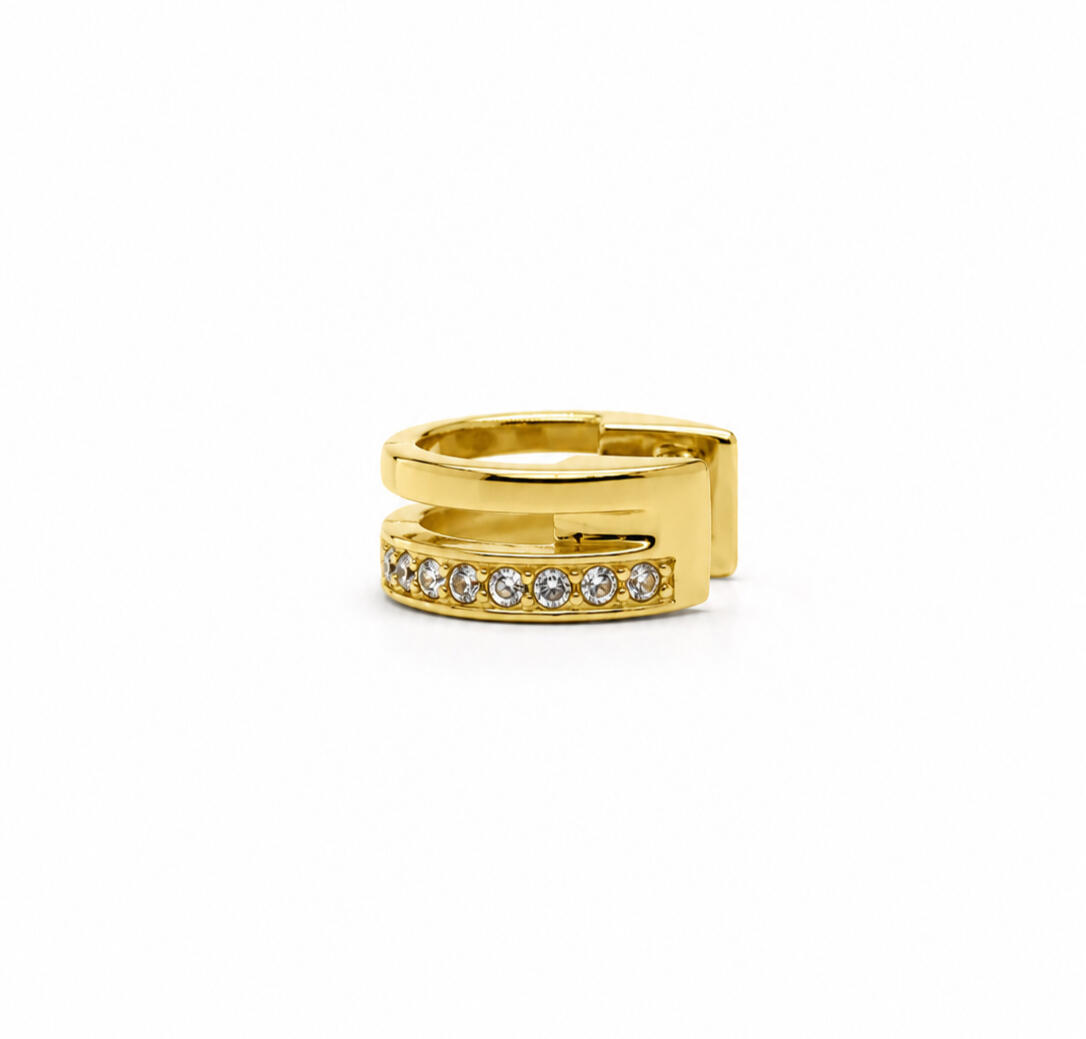 a gold hair cuff on white background